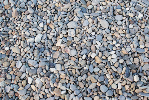 Stones by the sea, pebbles on the beach, sea coast.