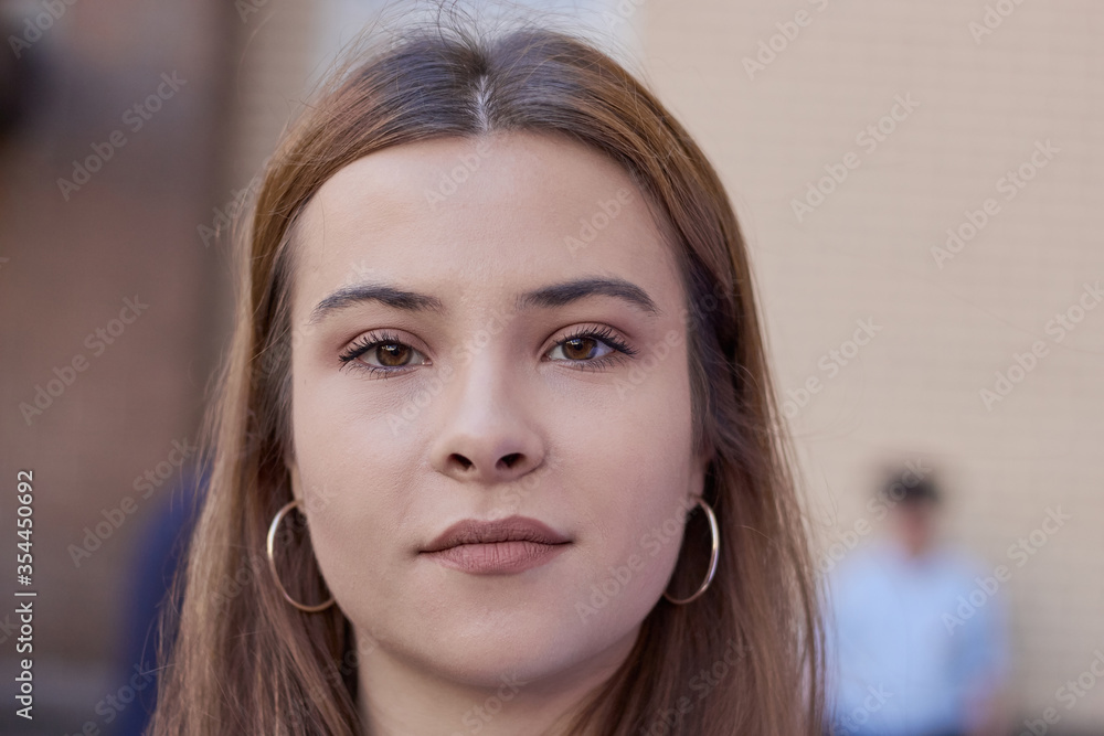 portrait of a brunette student with long hair smiling portrait of a brunette student with long hair smiling
