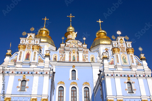 Fotografie Church with blue walls and gold dooms