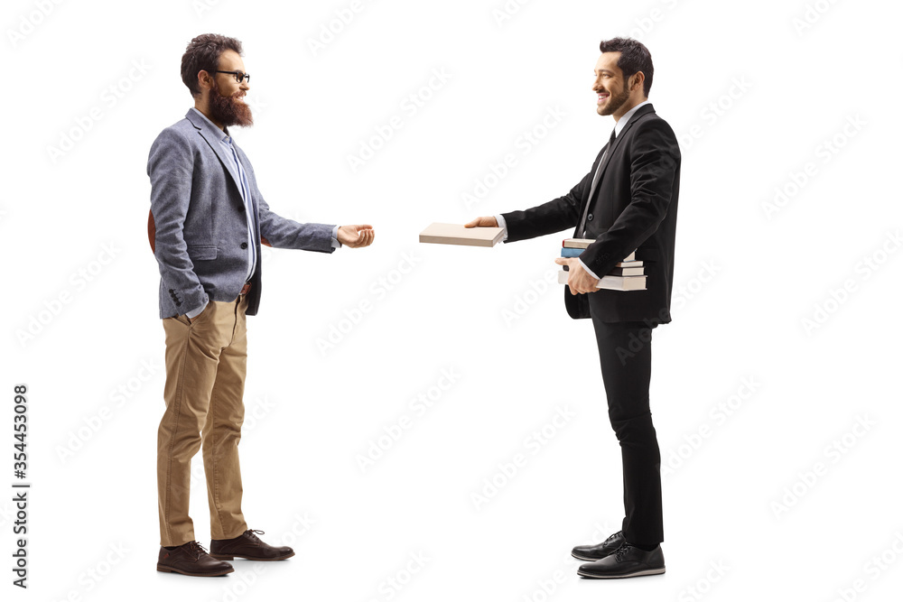 Businessman giving a book to a bearded man Businessman giving a book to a bearded man