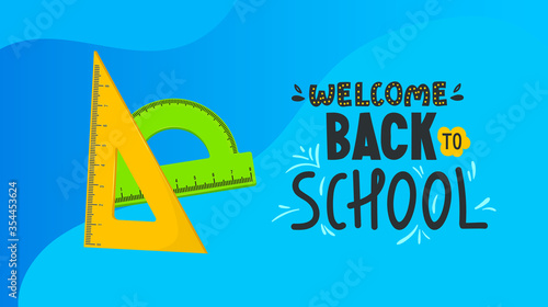 School banner with colorful rulers and text.