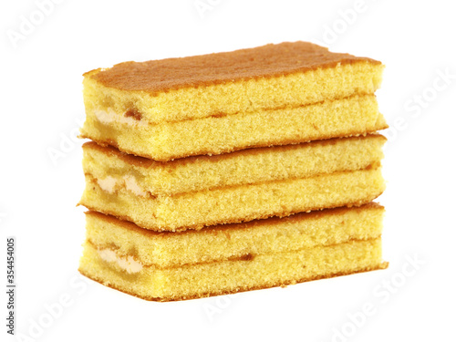 Sponge Cake with fruit cream filling isolated on white