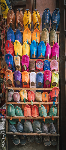 Colorful handmade leather slippers babouches on a market souk in the medina of Marrakech, Morocco © Mathias