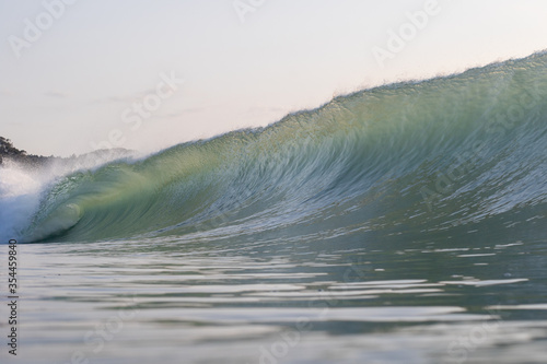 Waves breaking in Japan. The Pacific Ocean & its waves often generated by a Typhoon. The stunning coastline of Japan, Travellers like to visit the beach & watch the swell turn into waves & break photo