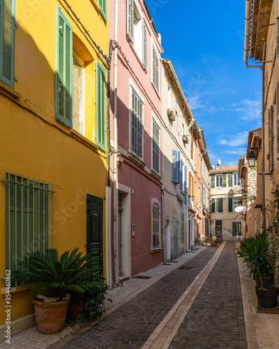 A pedestrian alleyway with colorful houses in the picturesque resort town of Cassis in Southern France