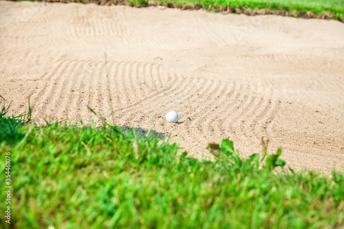 Golf ball on a bunker at Zlati Gric a golf course in Slovenia photo