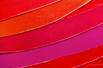 Lip gloss or lipstick pink red orange smudge background texture