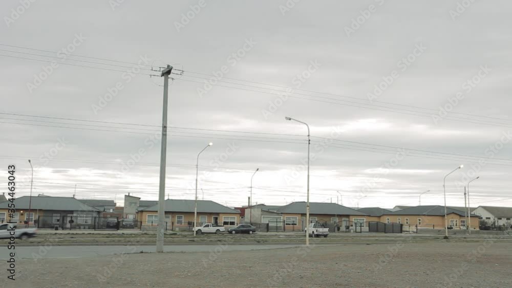 Residential Houses and a Highway in a Neighborhood of Rio Gallegos, in Santa Cruz province, Patagonia, Argentina. Residential Houses and a Highway in a Neighborhood of Rio Gallegos, in Santa Cruz province, Patagonia, Argentina.