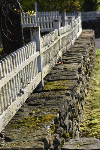 fence on stone wall