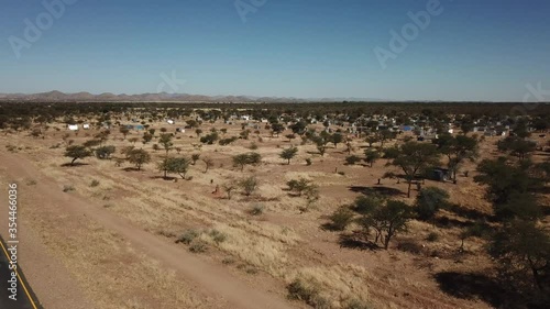 4K aerial drone video of Karibib, a small town in Erongo Mountains at B1 highway to west coast of Namibia and its township on hot sunny day in Erongo Region, central Namibia photo