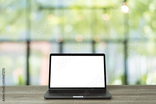 Wallpaper Mural Front view of the laptop on the work desk the natural in the forest blur background. Torontodigital.ca