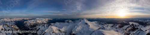 Aerial Panoramic View of Canadian Mountain Landscape during a colorful sunset. Located near Squamish  North of Vancouver  British Columbia  Canada. Nature Background Panorama