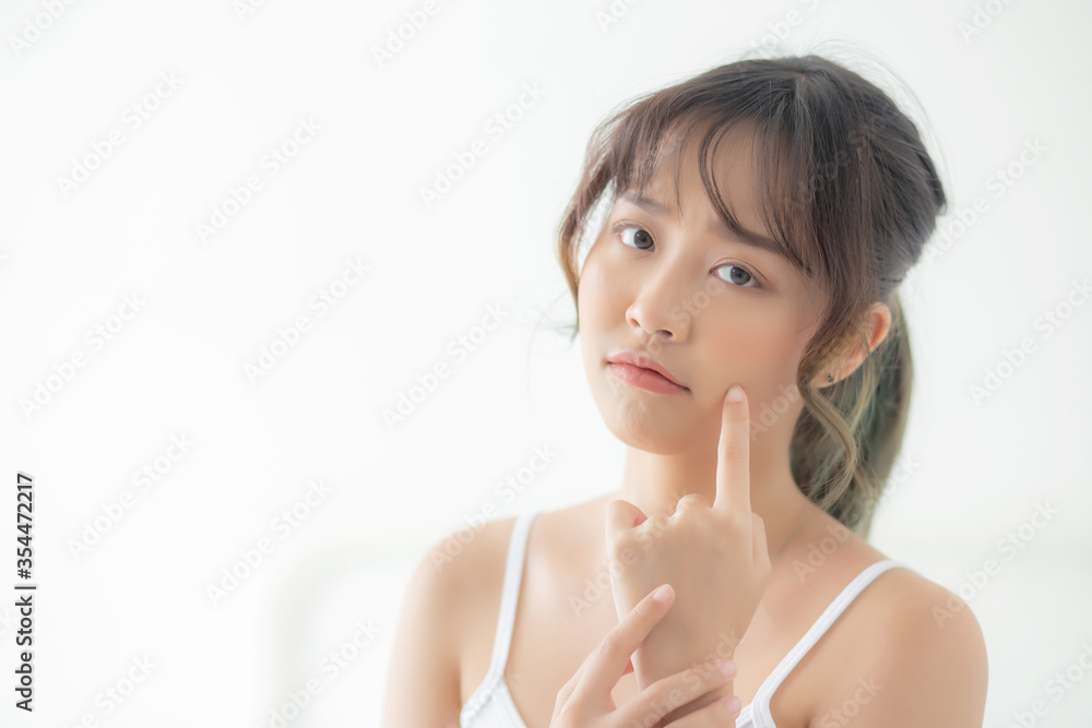 Beautiful portrait young asian woman with acne problem in the bedroom, trouble of beauty on face, zit treatment, asia girl is pimple having worry and displeased, skincare and healthy concept. Beautiful portrait young asian woman with acne problem in the bedroom, trouble of beauty on face, zit treatment, asia girl is pimple having worry and displeased, skincare and healthy concept.