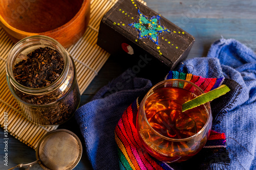 black tea on a vintage background  for a hot day  organic with a bottle