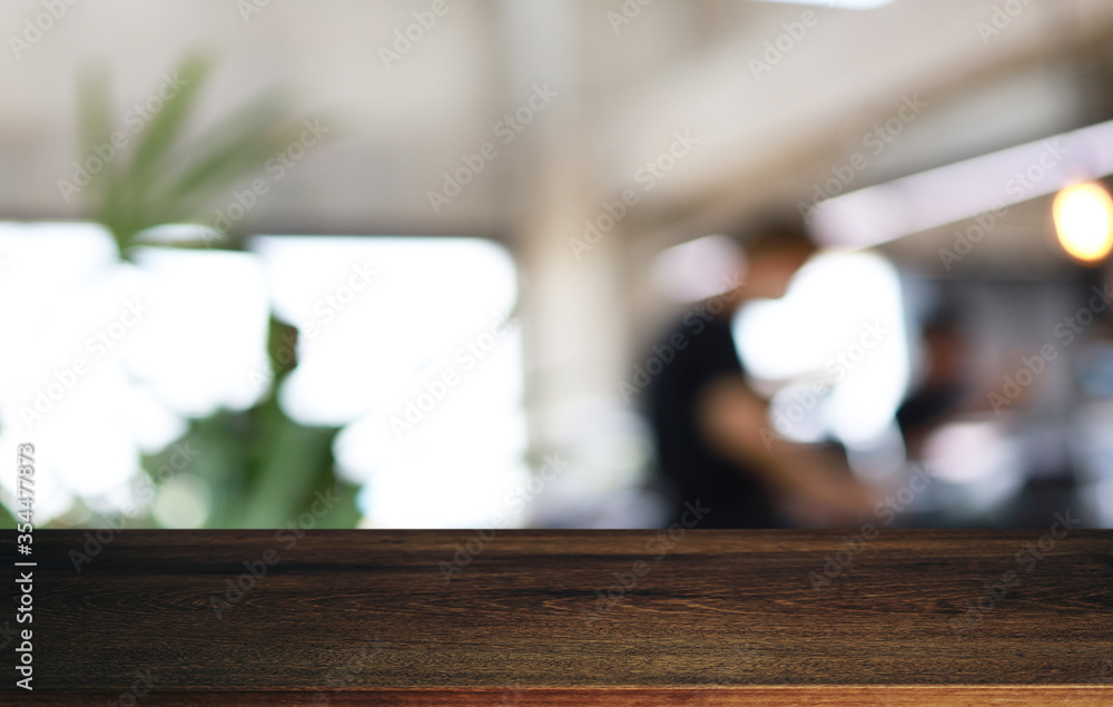 Wood Table Top in Blur Background room interior with empty copy space. Wood Table Top in Blur Background room interior with empty copy space.