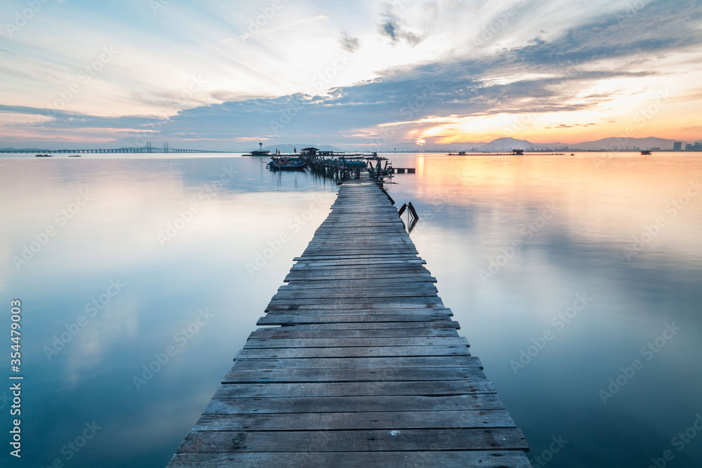 Obraz premium Real wooden bridge view of sunrise background