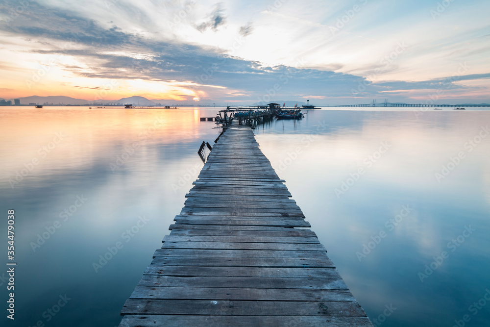 Real wooden bridge view of sunrise background Real wooden bridge view of sunrise background