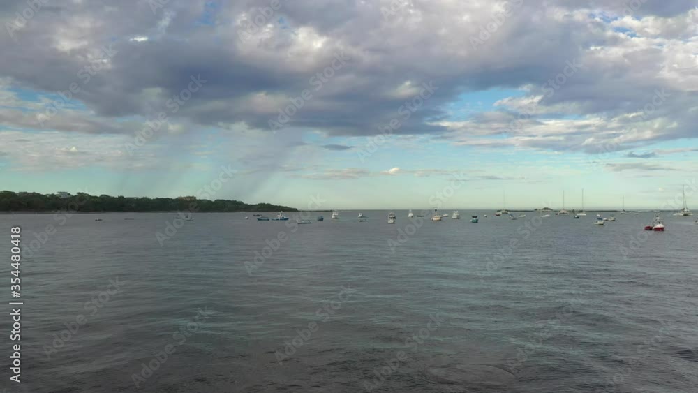 Waves crashing on a private beach in Costa Rica. Boats docked in the horizon Waves crashing on a private beach in Costa Rica. Boats docked in the horizon