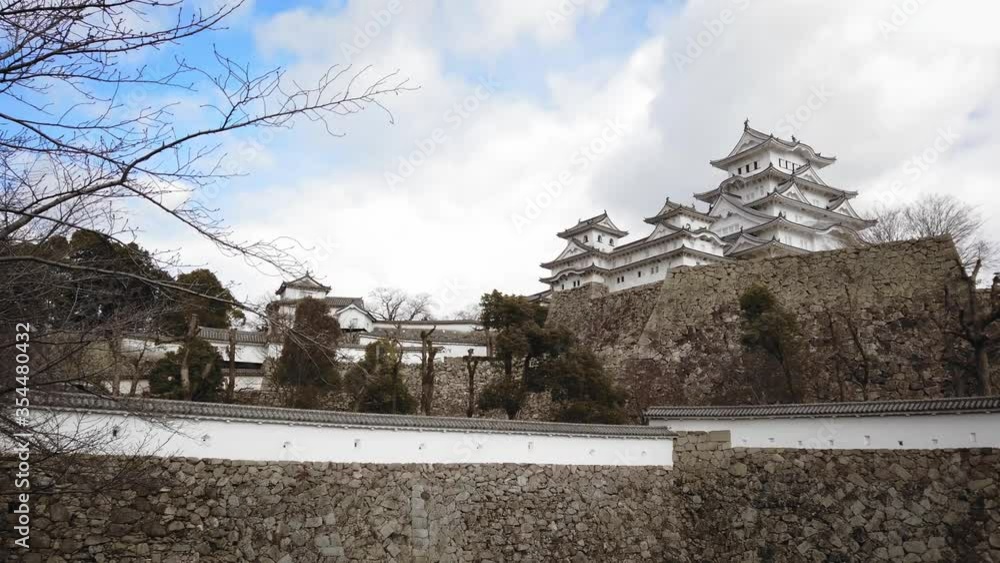 The Ancient Himeji Castle In Hyogo, Japan - Historic Travel Destination - panning up right shot The Ancient Himeji Castle In Hyogo, Japan - Historic Travel Destination - panning up right shot