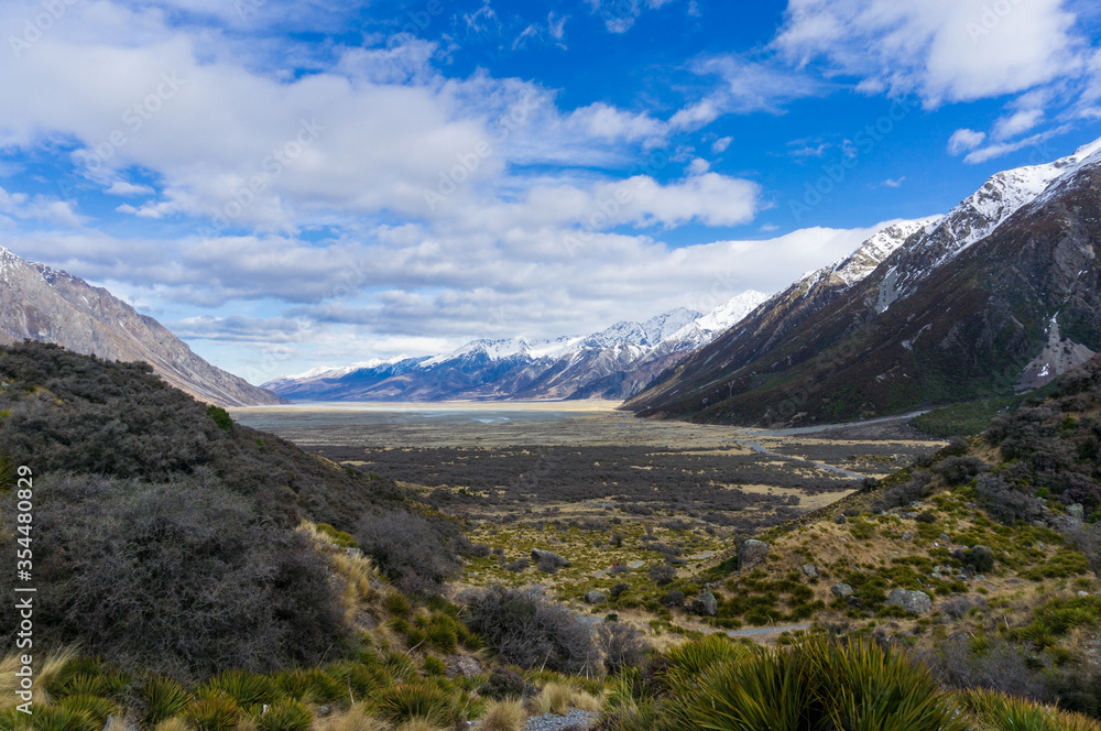 Mountain valeey landscape with snow-capped mountains. New Zealand