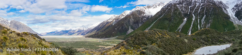 Mountain valley landscape panorama with snow-capped mountains. New Zealand