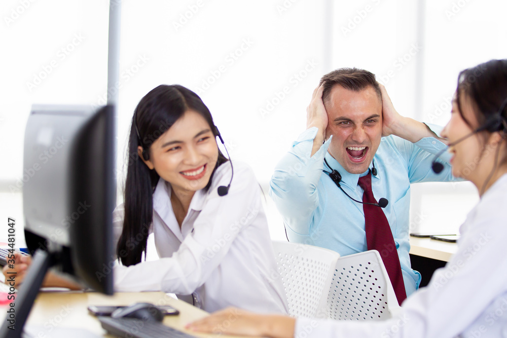 Harmful noisy environment in the workplace issue. A man screaming to his colleague who enjoy talking louder in the office. Stress and problem in workplace with co-worker and other employees concept. Harmful noisy environment in the workplace issue. A man screaming to his colleague who enjoy talking louder in the office. Stress and problem in workplace with co-worker and other employees concept.