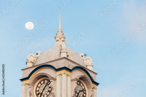 Close up view of clock tower with blue sky in George Town Penang photo