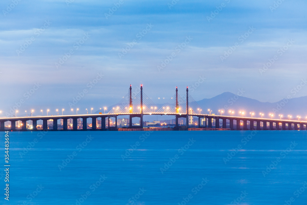 Penang Bridge view which located in the Straits of Malacca with venus and moon background
