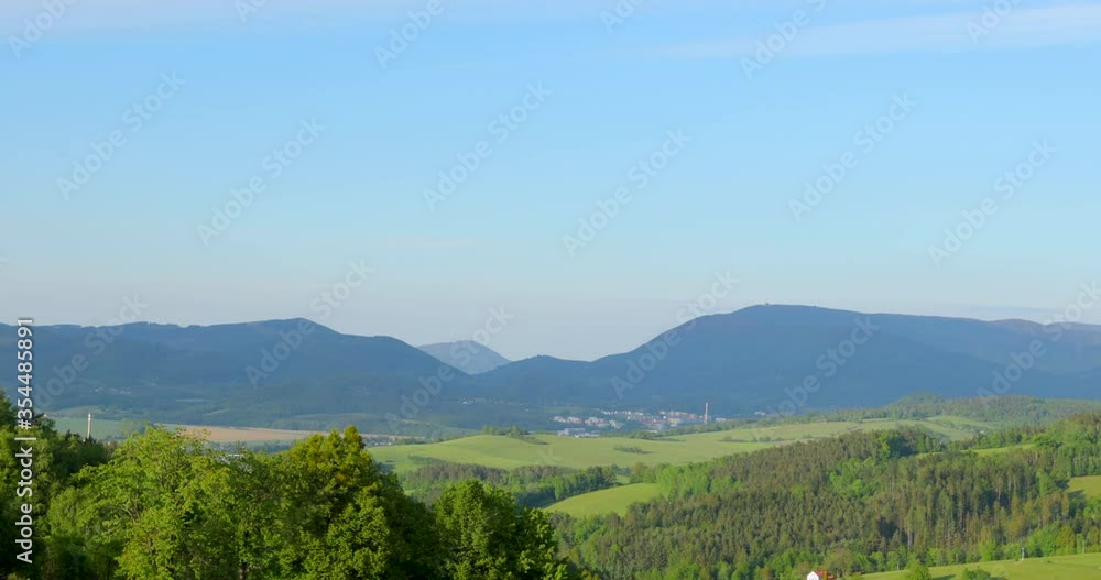 Zoom outside mountainous landscape of the Beskydy protected area with a view of the surrounding forests and the valley in which the town of Zubri lies. Zoom outside mountainous landscape of the Beskydy protected area with a view of the surrounding forests and the valley in which the town of Zubri lies.