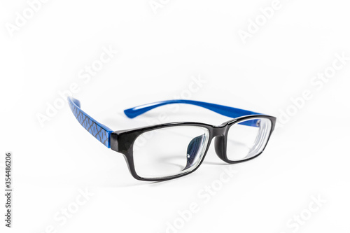 Blue black frame spectacles glasses in a white isolated background 