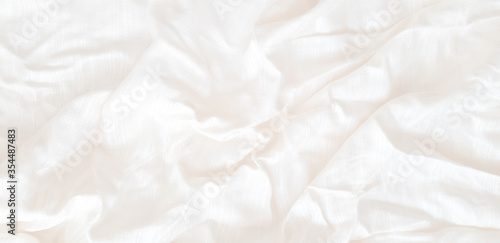 The white patterned fabric wrinkles using soft focus.