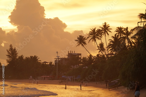 Gorgeous empty beach at golden hour sunset time in Sri Lanka photo