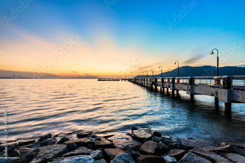 Jerejak Pier view during sunrise by the shore of Bayan Mutiara