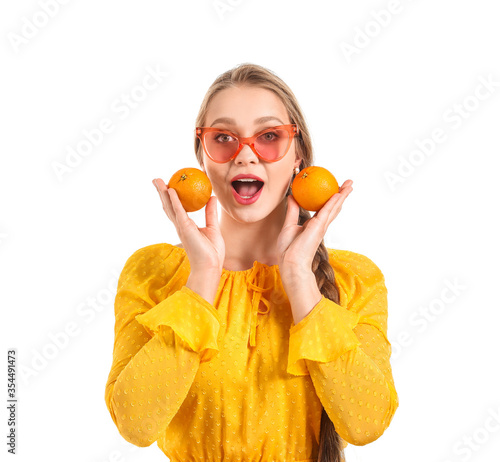 Young woman with tangerines...