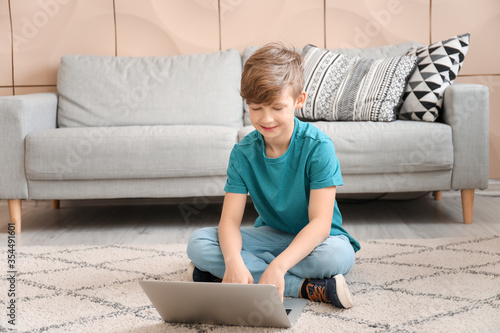 Cute little boy with laptop...