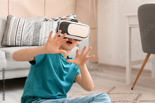 Cute little boy with VR gla...