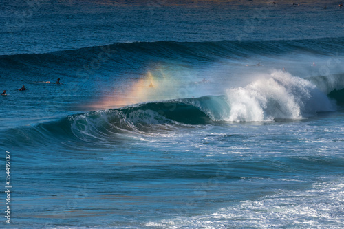 Rainbow over a breaking wave  Sydney Australia