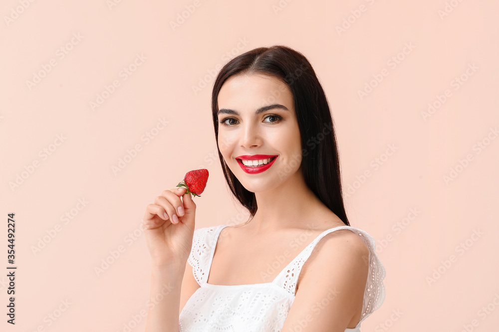 Sexy young woman with strawberry on light background Sexy young woman with strawberry on light background