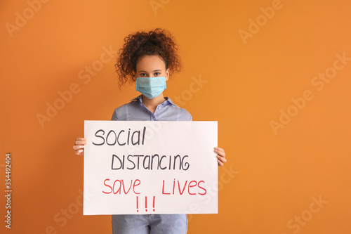 Young woman holding paper w...