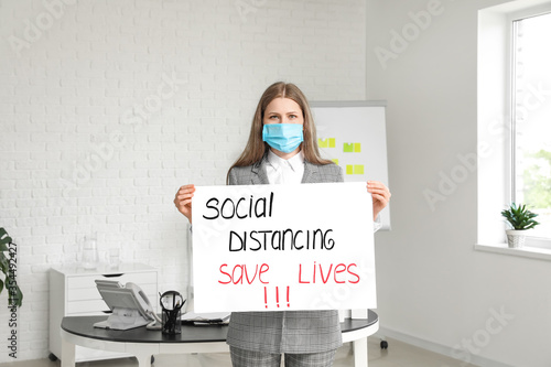 Young woman holding paper w...