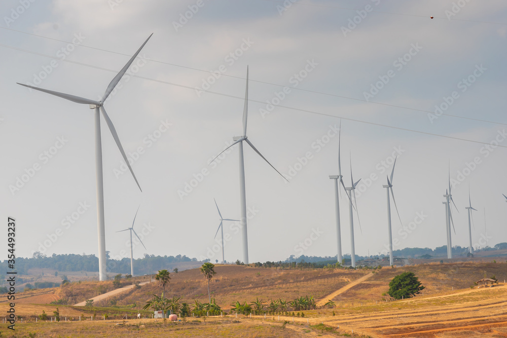 Windmill Field landscape view of Asia countryside,wind turbines, natural power generation plant in the mountains,Technology and alternative energy to reduce global warming concept.
