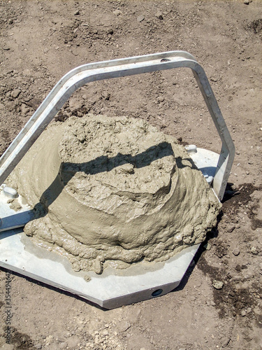 Photography Concrete slump test  from cone to determine workability