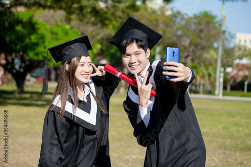 happy graduate friends take selfie