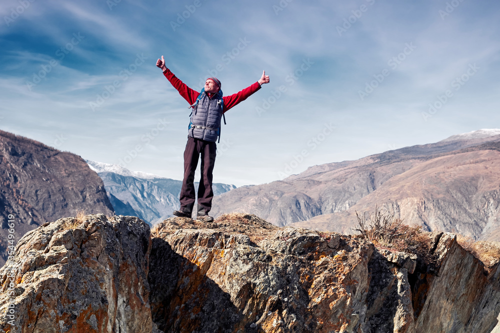 Man with backpack hiking in mountains. Travel Lifestyle success concept adventure active vacations outdoor mountaineering sport Man with backpack hiking in mountains. Travel Lifestyle success concept adventure active vacations outdoor mountaineering sport