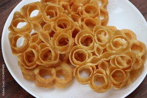 Rose Cookies or Achu Murruku, achapum, puvvulu, typical Anglo Indian cookie and the favorite among Indian Christians during christmas, made with flour, sugar, milk, popular in South India photo