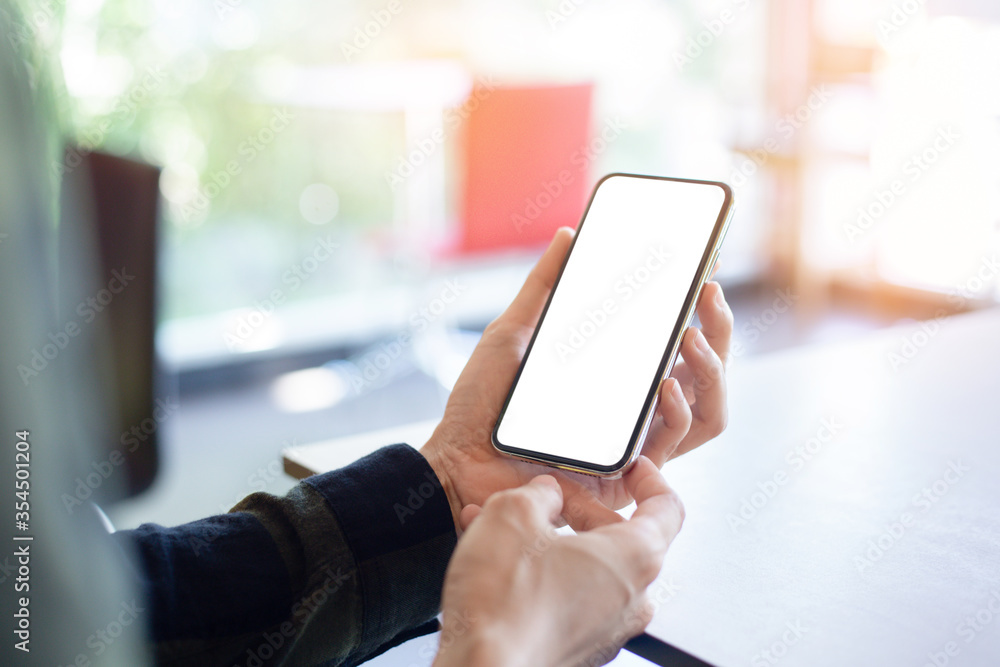 cell phone mockup image blank white screen.woman hand holding texting using mobile on desk at coffee shop.background empty space for advertise.work people contact marketing business,technology cell phone mockup image blank white screen.woman hand holding texting using mobile on desk at coffee shop.background empty space for advertise.work people contact marketing business,technology