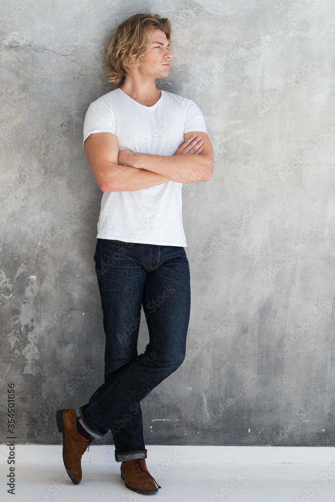 Young handsome male posing in studio, fashion style Young handsome male posing in studio, fashion style