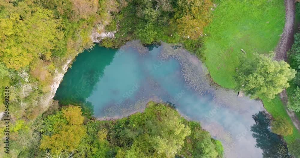Birds eye view of a blue water lake surrounded by trees. Beautiful nature Slovenija Birds eye view of a blue water lake surrounded by trees. Beautiful nature Slovenija
