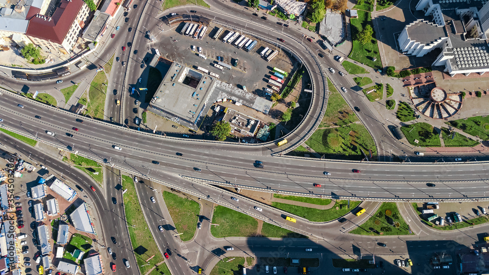 Aerial top view of road junction from above, automobile traffic and jam of many cars, transportation concept
