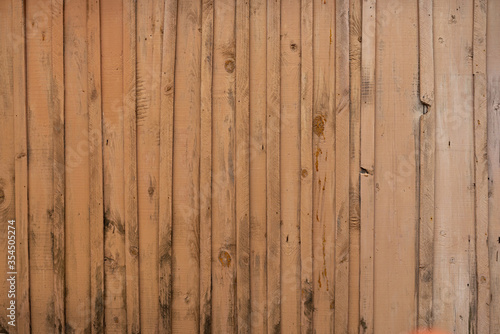 Obraz na płótnie Texture of a yellow fence made of wooden boards w salonie